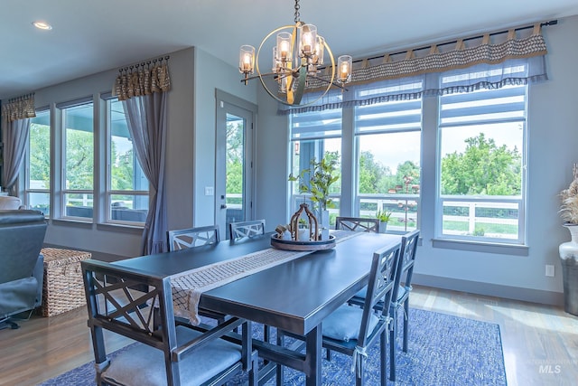 9473 W Suttle Lake Dr, Boise, ID 83714 - dining area featuring a chandelier, healthy amount of natural light, wood finished floors, and recessed lighting