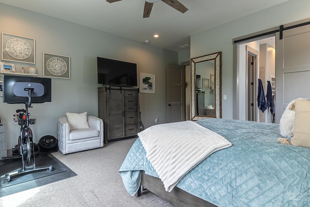 9473 W Suttle Lake Dr, Boise, ID 83714 - carpeted bedroom with a barn door, recessed lighting, and a ceiling fan