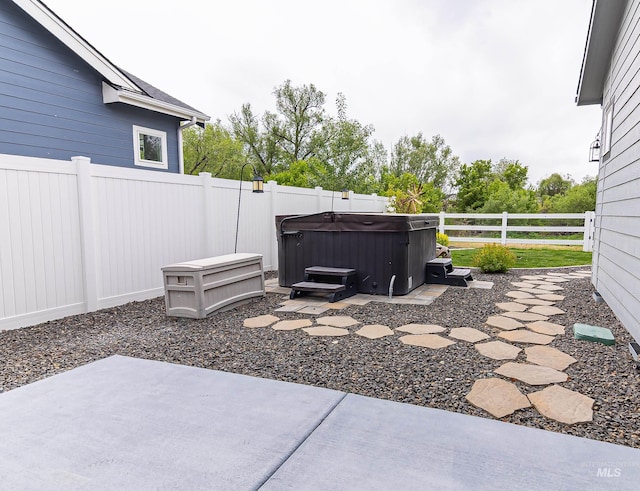 9473 W Suttle Lake Dr, Boise, ID 83714 - fenced backyard with a patio and a hot tub
