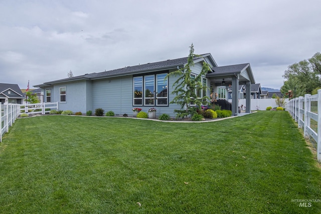 9473 W Suttle Lake Dr, Boise, ID 83714 - rear view of property with a ceiling fan