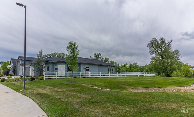 9473 W Suttle Lake Dr, Boise, ID 83714 - view of yard with a garage