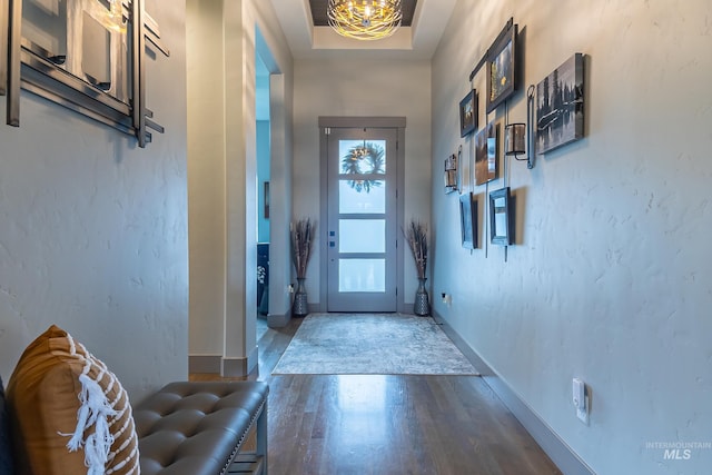 9473 W Suttle Lake Dr, Boise, ID 83714 - doorway to outside featuring wood finished floors and baseboards