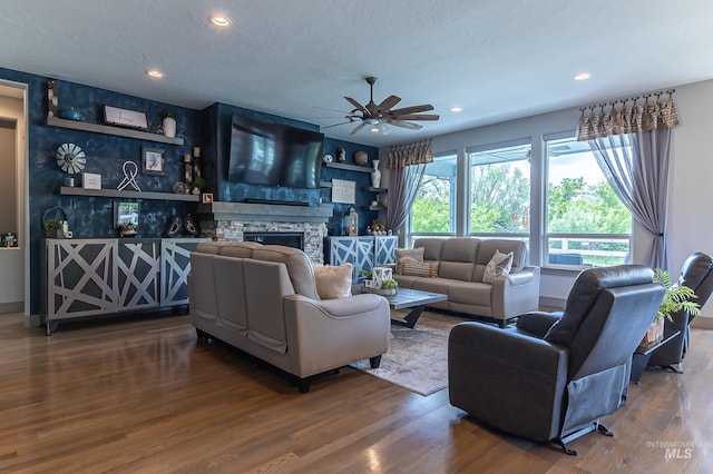 9473 W Suttle Lake Dr, Boise, ID 83714 - living area featuring ceiling fan, wood finished floors, a fireplace, and recessed lighting