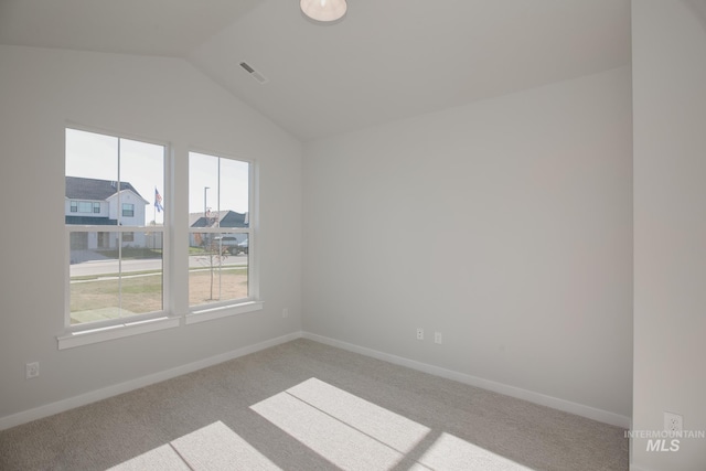 8196 E Red Horse St, Nampa, ID 83687 - empty room with lofted ceiling, visible vents, light colored carpet, and baseboards