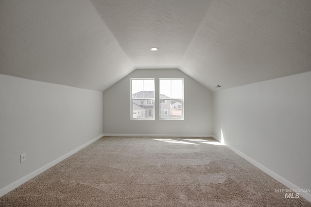 8196 E Red Horse St, Nampa, ID 83687 - bonus room with lofted ceiling, a textured ceiling, carpet flooring, visible vents, and baseboards