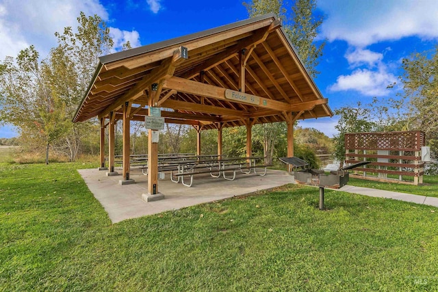 surrounding community featuring a gazebo, a patio area, and a lawn