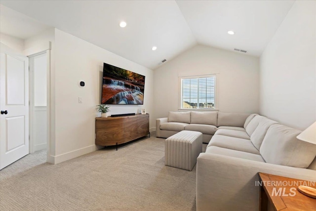 carpeted living room with lofted ceiling