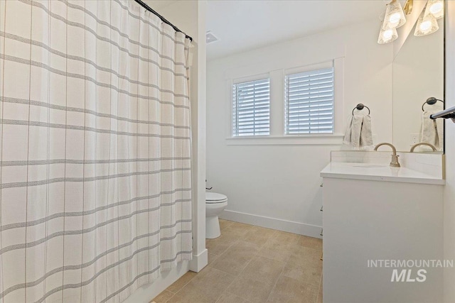 full bathroom featuring shower / tub combo, tile patterned floors, vanity, and toilet