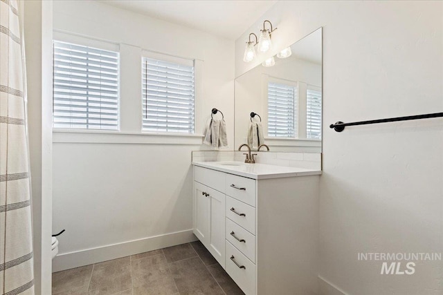 bathroom featuring tile patterned floors and vanity