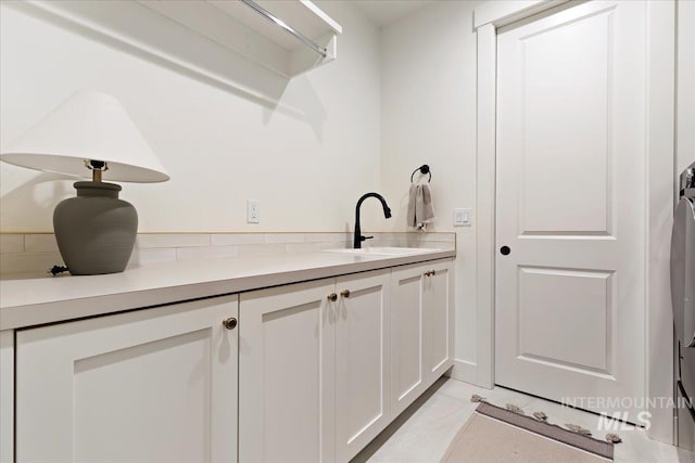 interior space featuring tile patterned flooring and vanity