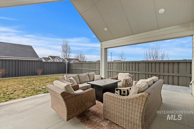 view of patio / terrace with an outdoor living space with a fire pit