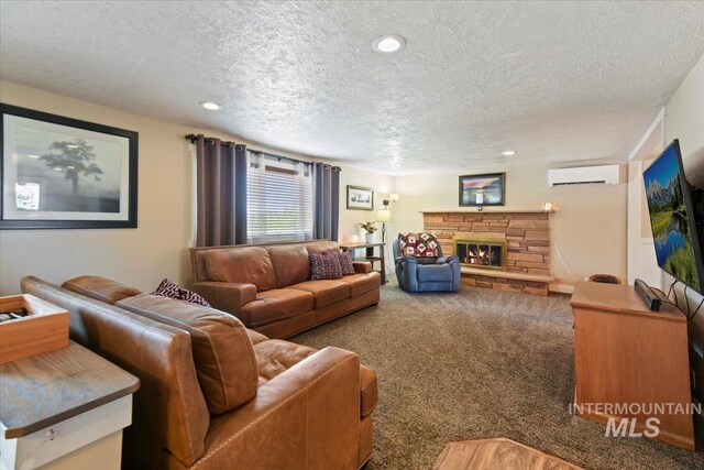 14525 Woosley, Nampa, ID 83651 - living area featuring a wall mounted AC, a textured ceiling, carpet floors, a fireplace, and recessed lighting