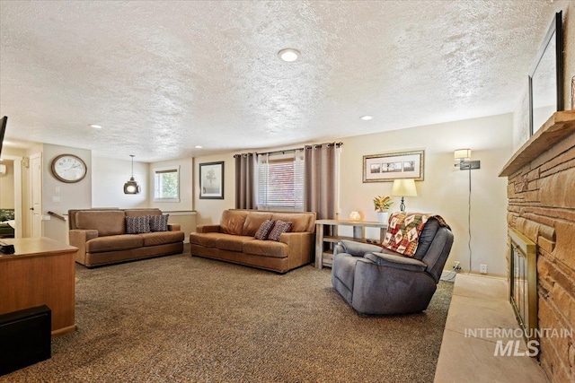 14525 Woosley, Nampa, ID 83651 - living area with carpet flooring, a textured ceiling, a fireplace, and recessed lighting