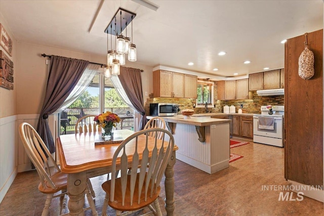 14525 Woosley, Nampa, ID 83651 - dining space with recessed lighting and a wainscoted wall