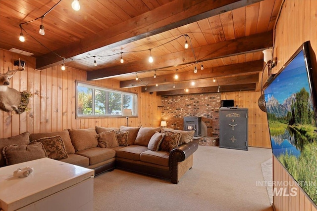 14525 Woosley, Nampa, ID 83651 - living area featuring wood ceiling with exposed beams, wood walls, carpet floors, and a wood stove