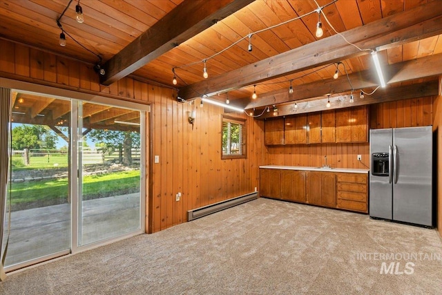 14525 Woosley, Nampa, ID 83651 - kitchen with stainless steel refrigerator with ice dispenser, baseboard heating, wooden ceiling with exposed beams, brown cabinets, and track lighting