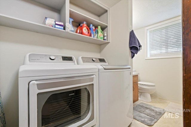 14525 Woosley, Nampa, ID 83651 - laundry room with independent washer and dryer and light tile patterned floors