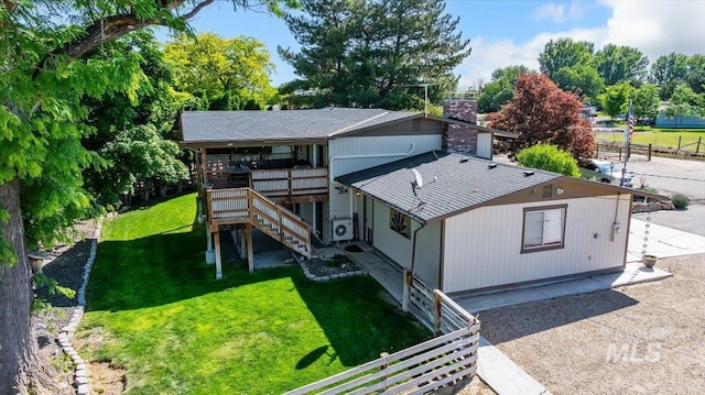 14525 Woosley, Nampa, ID 83651 - back of property featuring a chimney, a lawn, stairs, and a wooden deck