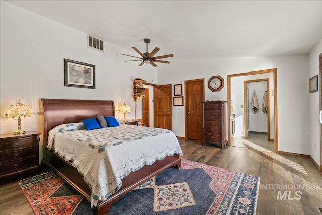 bedroom with vaulted ceiling, ceiling fan, and hardwood / wood-style flooring