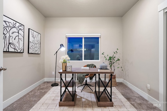 office space with light colored carpet and baseboards