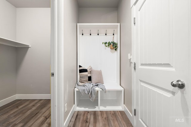 mudroom featuring wood finished floors and baseboards