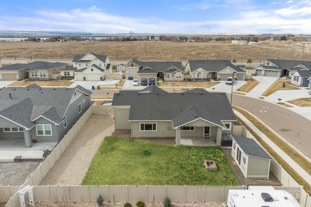 birds eye view of property with a residential view