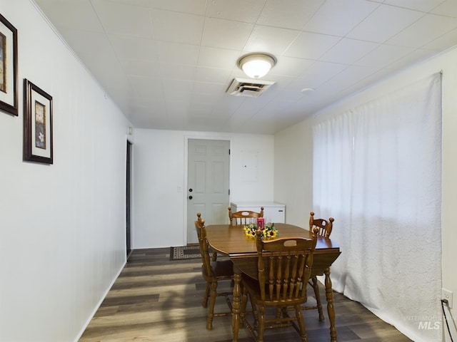 dining room with dark hardwood / wood-style floors