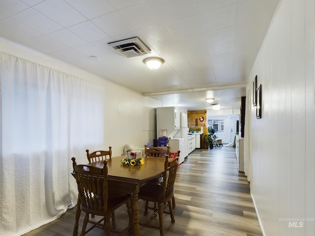 dining room with hardwood / wood-style floors