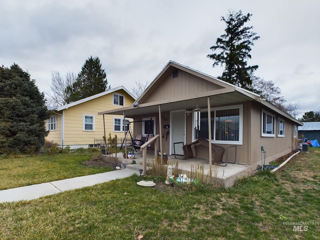 bungalow featuring a porch and a front yard