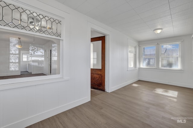 spare room with hardwood / wood-style floors and ceiling fan