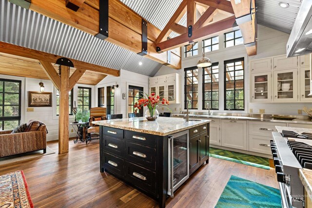 kitchen with white cabinetry, sink, and a healthy amount of sunlight