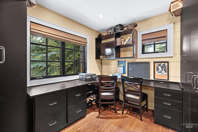 bathroom with hardwood / wood-style floors, toilet, and sink