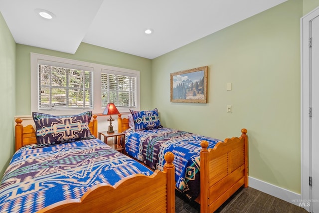 bedroom with dark wood-type flooring, recessed lighting, and baseboards