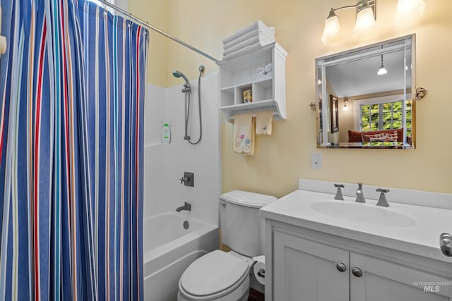 full bath with toilet, shower / tub combo with curtain, and vanity