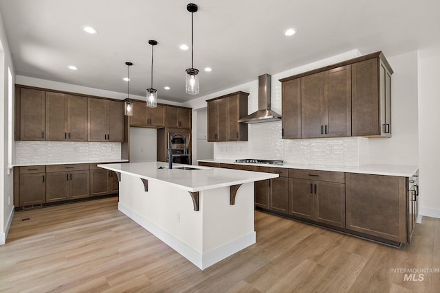 664 E Lockhart St, Meridian, ID 83646 - kitchen with wall chimney exhaust hood, light wood-style flooring, gas cooktop, and recessed lighting