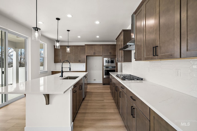 664 E Lockhart St, Meridian, ID 83646 - kitchen featuring a sink, light wood finished floors, light countertops, appliances with stainless steel finishes, and recessed lighting