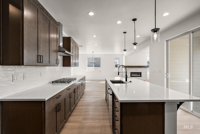 664 E Lockhart St, Meridian, ID 83646 - kitchen with light wood finished floors, stainless steel appliances, a sink, and recessed lighting