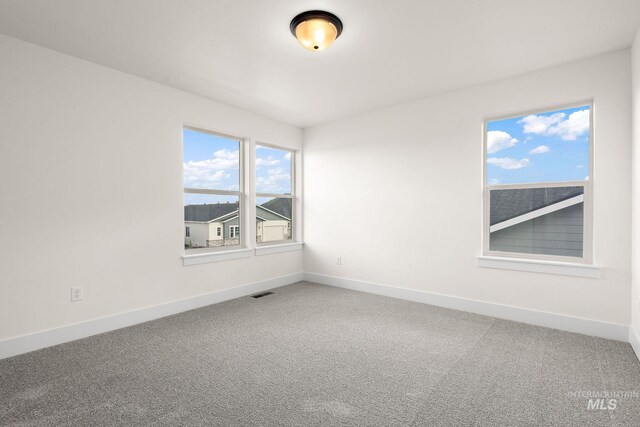664 E Lockhart St, Meridian, ID 83646 - spare room with baseboards, visible vents, and carpet