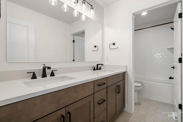 664 E Lockhart St, Meridian, ID 83646 - bathroom featuring tile patterned flooring, double vanity, toilet, and a sink