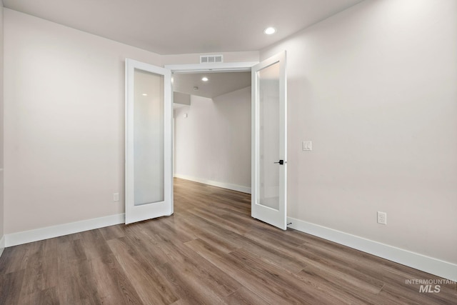 664 E Lockhart St, Meridian, ID 83646 - unfurnished room featuring french doors, baseboards, visible vents, recessed lighting, and wood finished floors