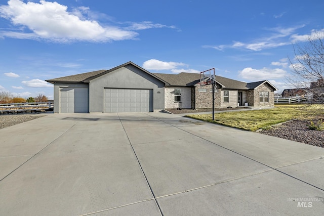 single story home featuring a front lawn and a garage