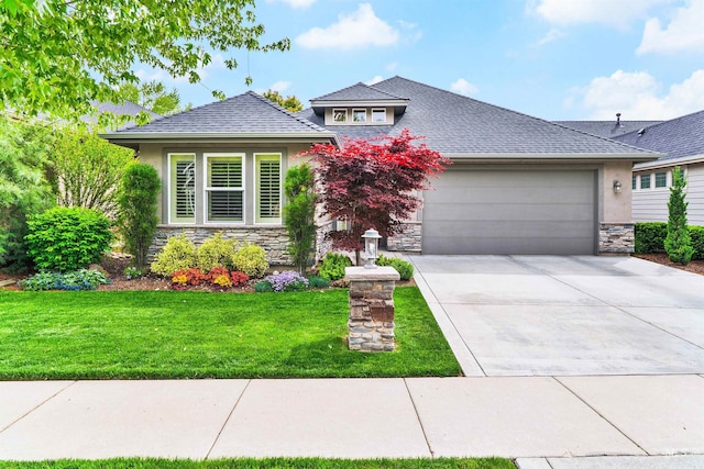 view of front of property featuring stone siding, stucco siding, a garage, and a front yard