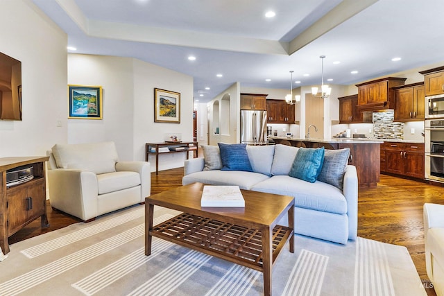 living room with wood finished floors and recessed lighting