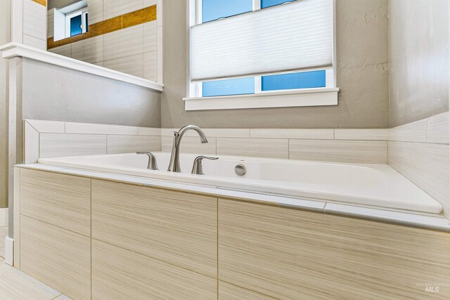bathroom featuring a garden tub