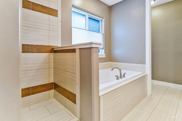 bathroom with a bath, tile patterned floors, and a tile shower
