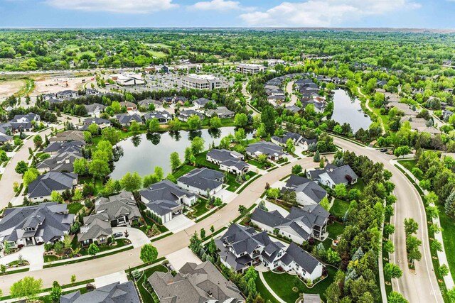 aerial view of residential area with a large body of water