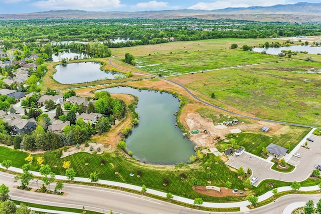 view of property location with a water and mountain view