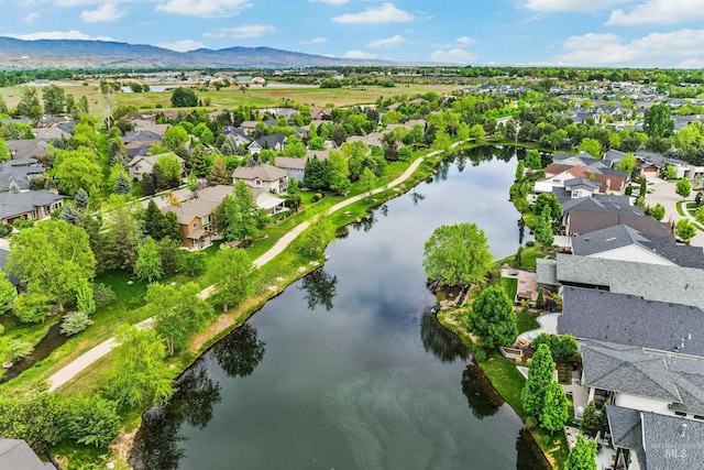 aerial perspective of suburban area with a water and mountain view