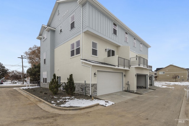 exterior space with a balcony and a garage