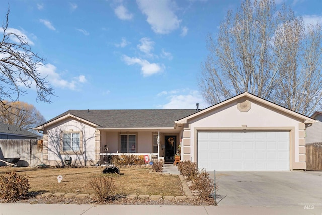 ranch-style home with fence, driveway, an attached garage, and stucco siding